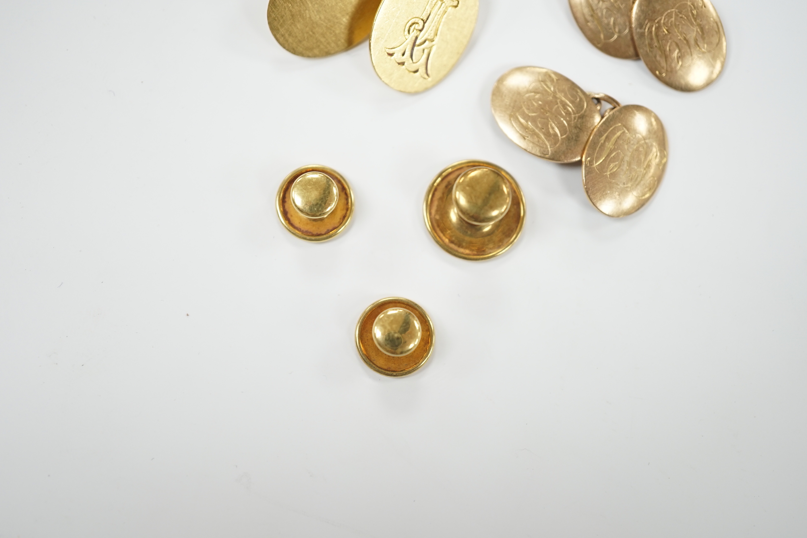 A pair of 18ct gold oval cufflinks, with engraved monogram, three 18ct dress studs and a pair of 9ct gold oval cufflinks